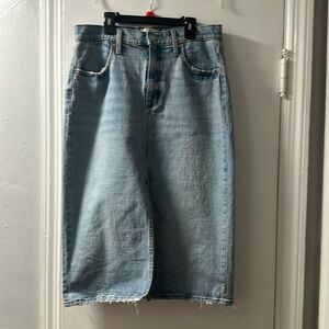 Denim skirt with front slit. Hits mid chin